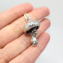 side view of 3D mushroom man necklace