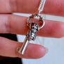 details of tiny honey bee sculpted onto an antique key in silver