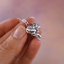 cute curled up fawn necklace with head tucked