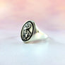 side view of smooth tapered band on silver dodo ring
