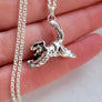 side profile of jumping feral cat pendant in sterling silver