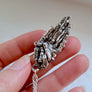 unique hand necklace made from maple tree branches