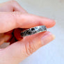 white tailed deer buck laying down on handsculpted silver ring