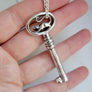 dungeon key in sterling silver with oval face and a handsculpted rat on top