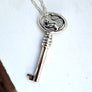 Silver key necklace featuring a rat motif handmade by xanne fran studios