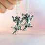 two raccoon necklaces next to eachother to show quality consistency