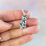 smiling meditative cat charm