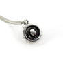 hidden alien on backside of silver charm