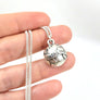 handcrafted silver earthling pendant