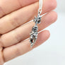 crying mandrake charm necklace