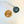brain pendant next to penny to show smaller size
