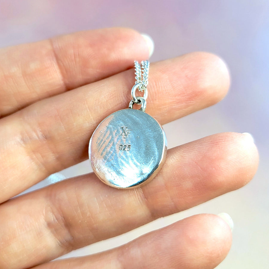 backside of pendant showing flat, solid sterling silver with 925 hallmark and XF makers mark