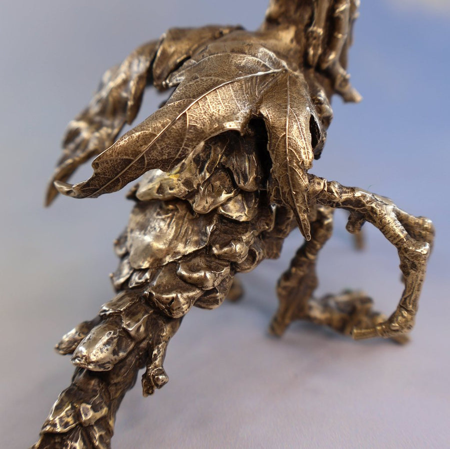 maple leaf wings on a bronze fairy dragon