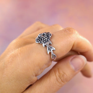 side profile of dandelion ring with lion face