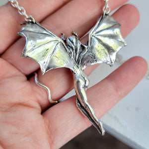 backside of evil woman necklace showing hallmark and XF maker's mark