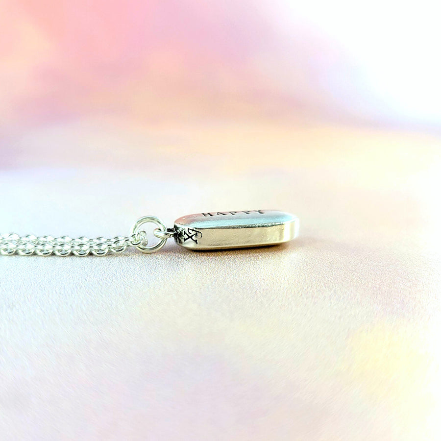 side view showing 3D pill shape of drug pendant