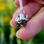 close up of cute little smile on sterling silver snail handmade by xanne fran