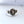 signet ring with the words "just visiting" framing an alien head