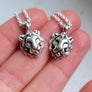 Two handmade silver lion necklaces by xanne fran studios