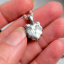 backside of lion charm necklace showing silver hallmark and XF makers mark