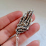 unique skeleton hand necklace in solid sterling silver