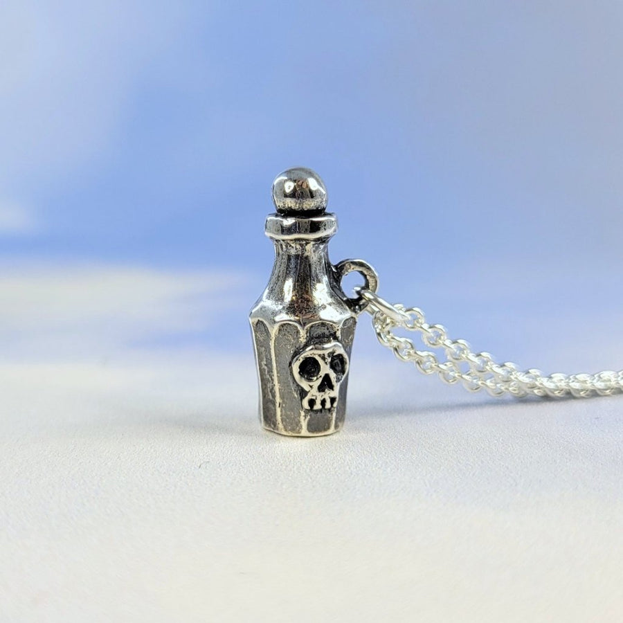 potion bottle necklace by xannefran