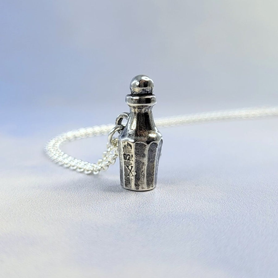 poison vial necklace in darkened sterling silver