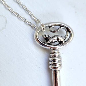 close up of 3D rat sculpted into a sterling silver key
