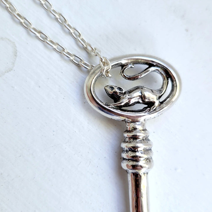 close up of 3D rat sculpted into a sterling silver key