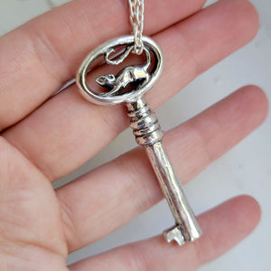 dungeon key in sterling silver with oval face and a handsculpted rat on top