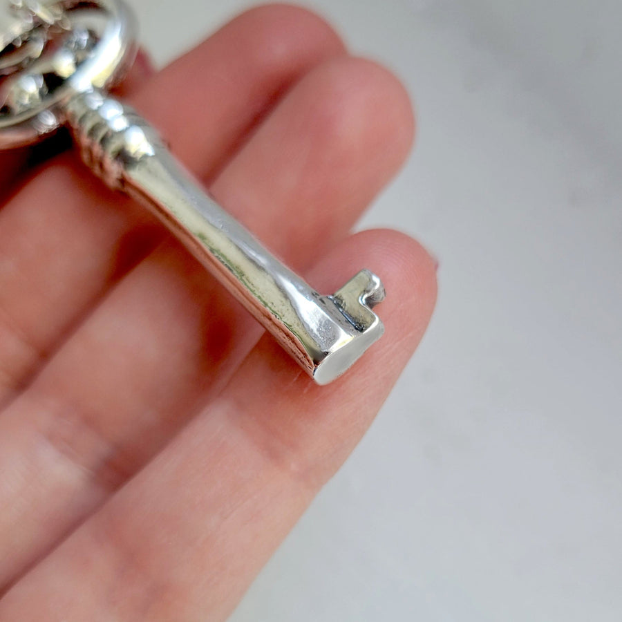 detail of bottom of key necklace, showing solid sterling silver shaft