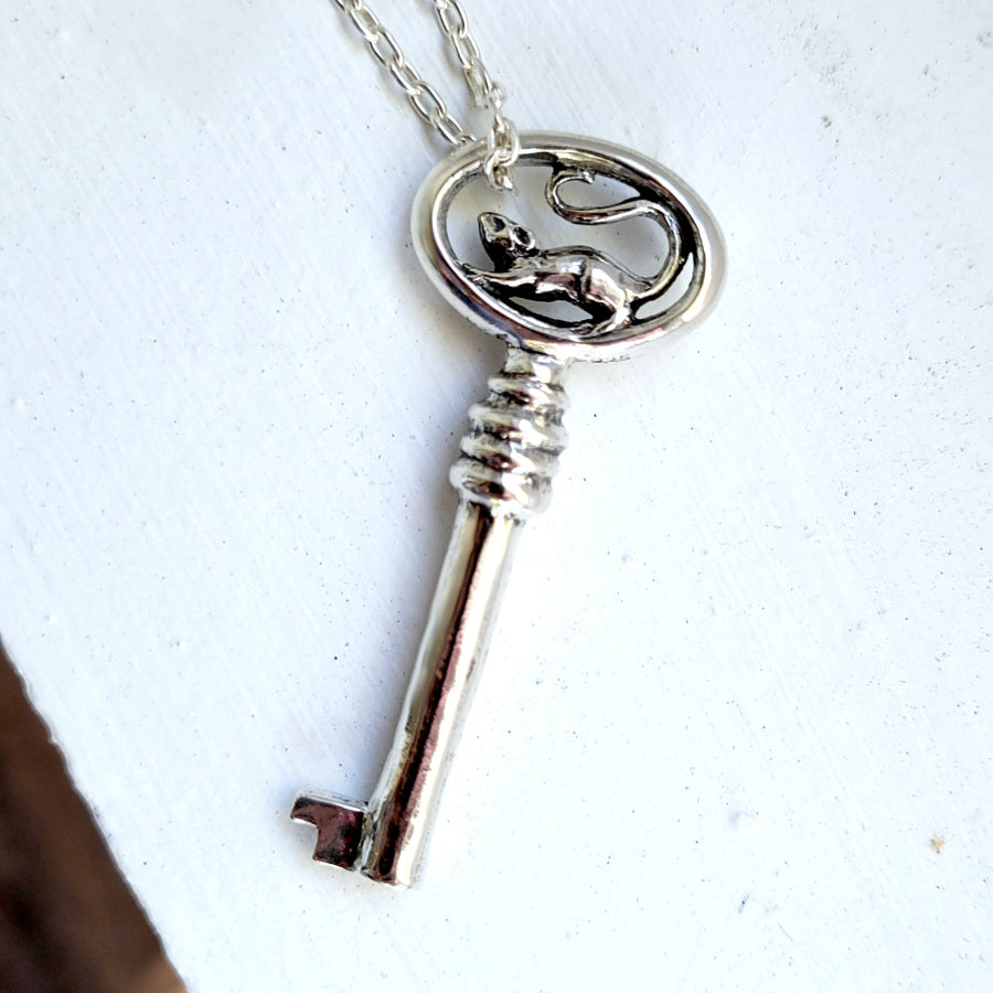 Silver key necklace featuring a rat motif handmade by xanne fran studios