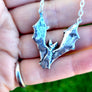 backside of silver bat necklace showing 925 hallmark and XF makers mark