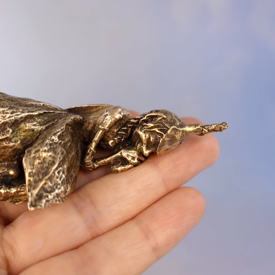 close up of fairy face resting on hands