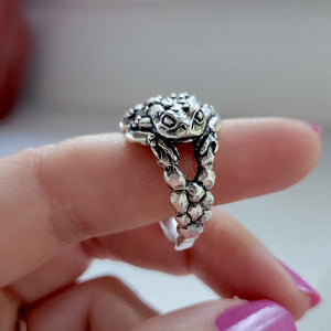 side view of toad ring showing face details and cobblestone texture on silver band