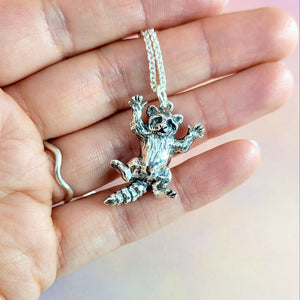 cute raccoon pendant hand sculpted by xannefran