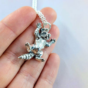 details of back feet on 3d raccoon charm