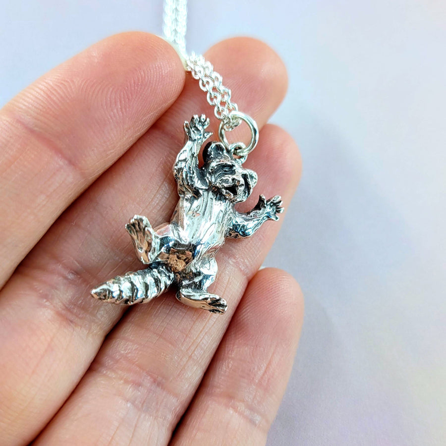 details of back feet on 3d raccoon charm