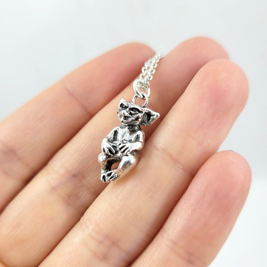 tiny silver goblin necklace