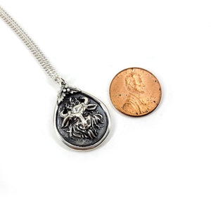 krampus necklace the size of a penny