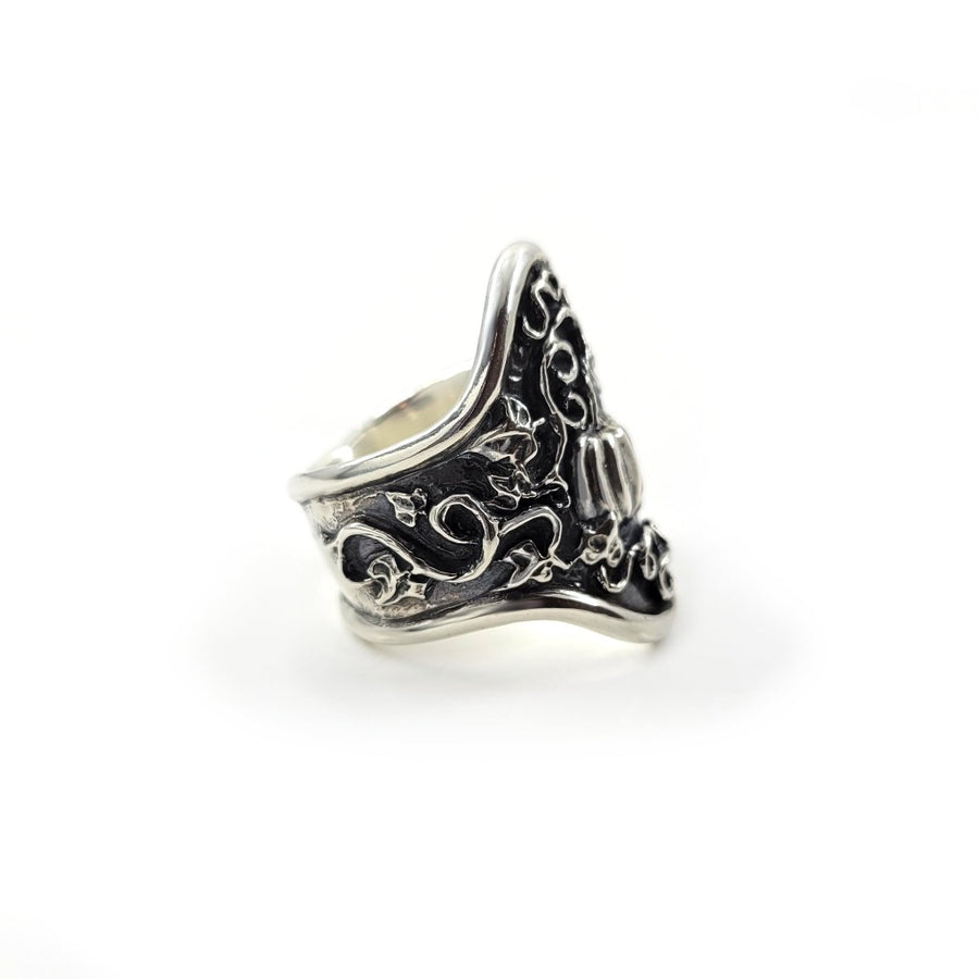 side view of pumpkin vines on silver ring